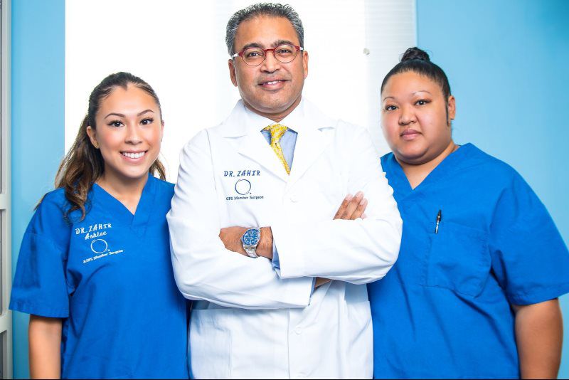 Dr. Zahir and two nurses